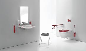 Bathroom fittings showing a red toilet seat and other fittings.