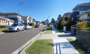 New housing development showing narrow footpath and nature strip.