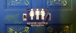 Gender Neutral restroom sign showing three figures