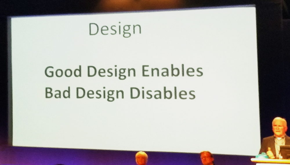 Slide at a conference with the words, good design enable. Bad design disables.