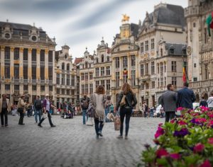 A medieval town square with a cobbled pavement.