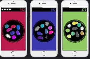 Three smart phones showing the colour game.