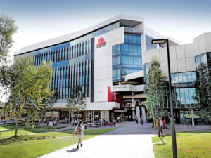 A view of Griffith University building which is new and about seven storeys high. Digital equity and autism.