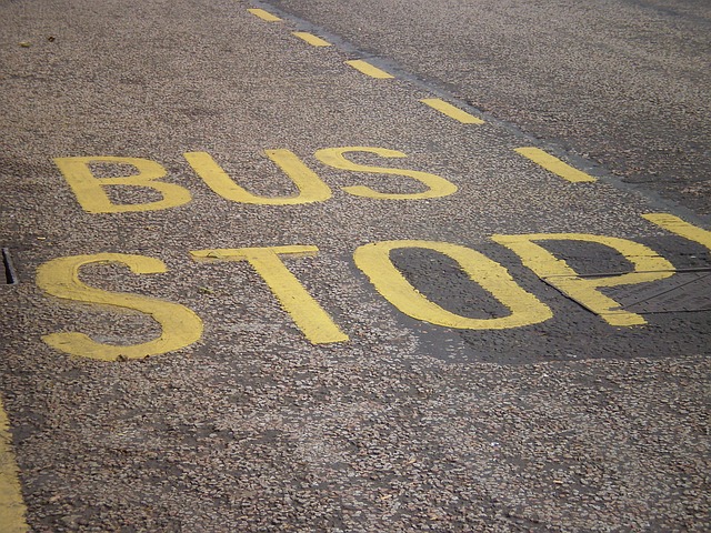 The roadway is marked with the words "bus stop" in yellow lettering.
