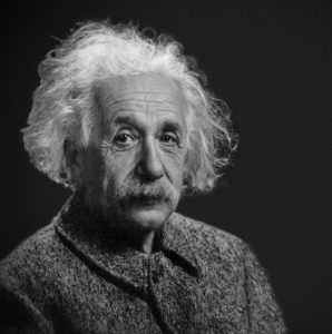 A black and white portrait of Albert Einstein.