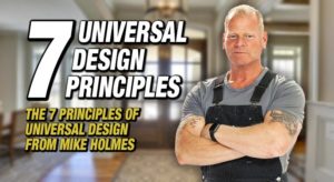 Mike Holmes stands in work gear with his muscled arms folded, smiling at the camera. A builder's view of UD.