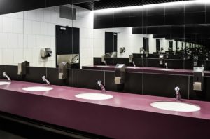A row of handbasins in a public toilet.