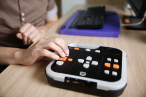 An image of a braille keyboard and an audiobook keyboard.