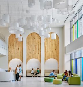 A large reception area with soft seating in the new hospital.