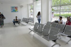 A hospital waiting area with just three people.