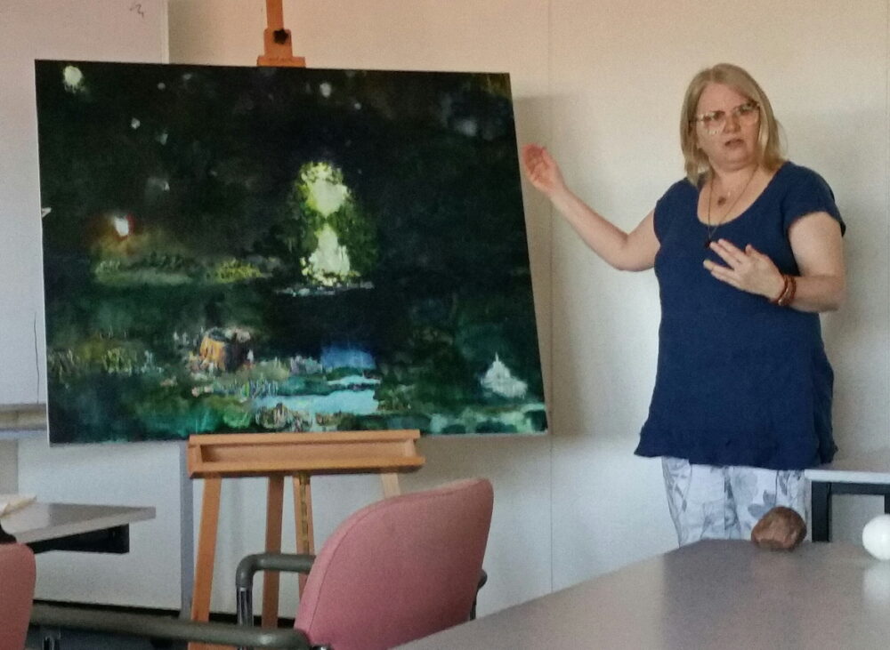 Co-researcher Megan Strickfadden audio-describing a painting. 