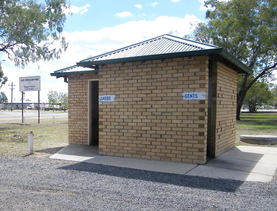 Standard toilet block in a rural area signed as Ladies and Gents.